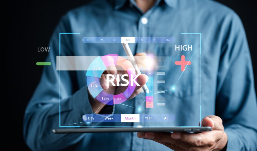 Business professional using a tablet to analyze a digital risk dashboard with colorful pie and bar charts, highlighting risk levels from low to high. A futuristic interface displays metrics, time filters, and a rising risk trend line, symbolizing data analysis and cybersecurity monitoring specifically provider SRAs.